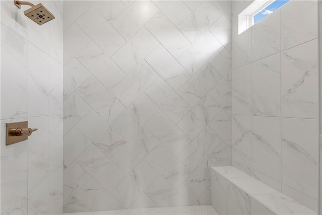 bathroom featuring a tile shower