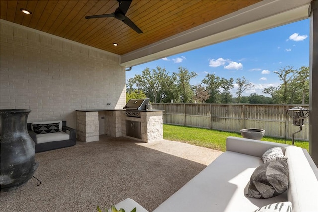 view of patio with ceiling fan, area for grilling, and outdoor lounge area