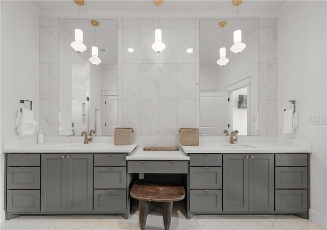 bathroom with vanity, ornamental molding, and tile walls