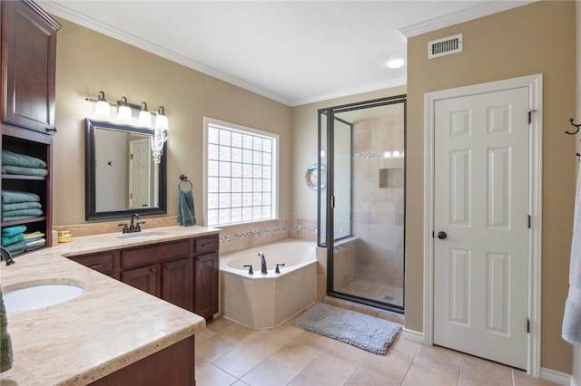 4719 Hunington Dr, Bryan, TX 77802 - full bathroom featuring vanity, a stall shower, a garden tub, crown molding, and tile patterned floors