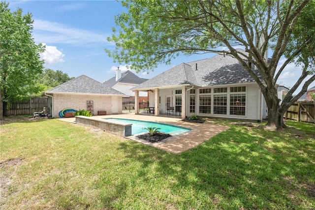 4719 Hunington Dr, Bryan, TX 77802 - rear view of house with a fenced backyard, a patio area, and brick siding