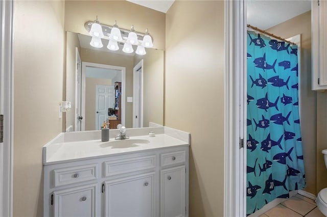 4719 Hunington Dr, Bryan, TX 77802 - full bath with vanity, tile patterned flooring, and a shower with curtain