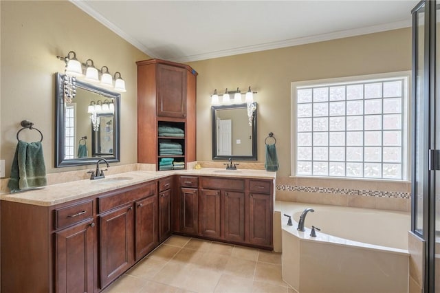 4719 Hunington Dr, Bryan, TX 77802 - bathroom featuring a garden tub, double vanity, tile patterned floors, and ornamental molding