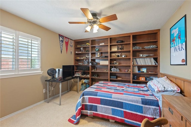 4719 Hunington Dr, Bryan, TX 77802 - bedroom with carpet floors and a ceiling fan
