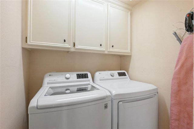 4719 Hunington Dr, Bryan, TX 77802 - washroom featuring separate washer and dryer and cabinet space