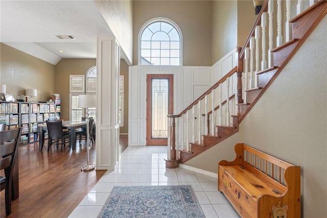 4719 Hunington Dr, Bryan, TX 77802 - tiled foyer with stairway and high vaulted ceiling