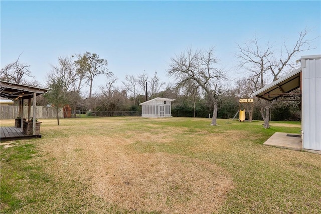 1002 Edgewood Dr, Bryan, TX 77802 - view of yard featuring an outdoor structure and a playground