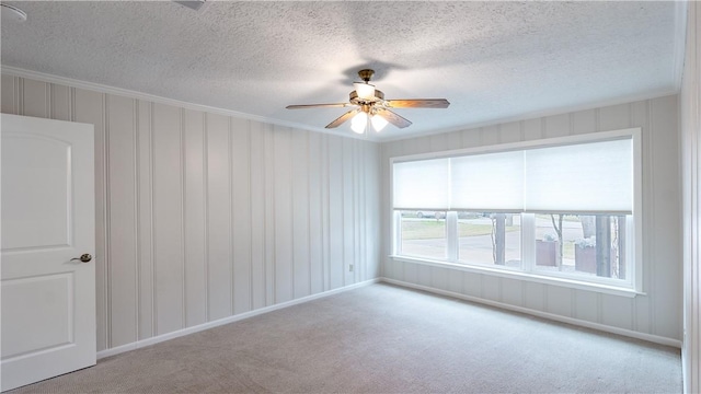 1002 Edgewood Dr, Bryan, TX 77802 - carpeted spare room featuring crown molding, a textured ceiling, and ceiling fan