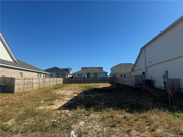 view of yard featuring central AC