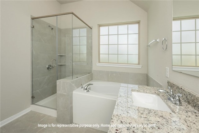 bathroom with plus walk in shower, tile patterned floors, and sink