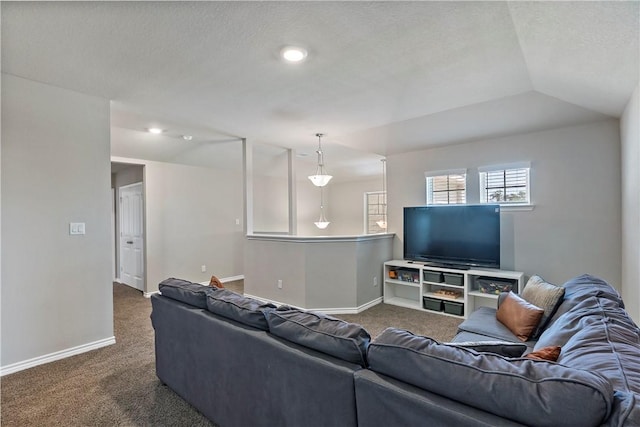 carpeted living room with vaulted ceiling