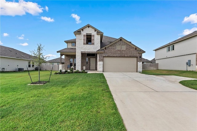 view of front of property with a front lawn and a garage