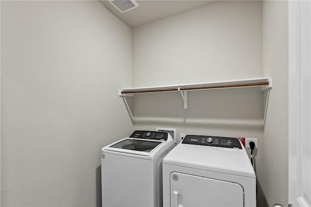 laundry room featuring washing machine and dryer