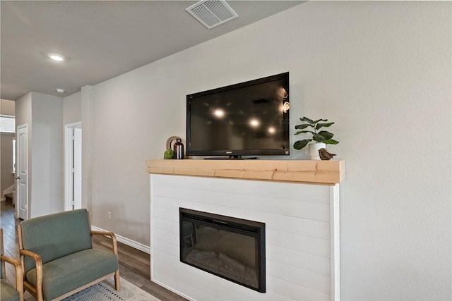 living room with dark hardwood / wood-style floors