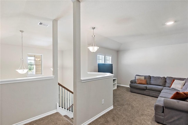 living room featuring carpet flooring, a wealth of natural light, and lofted ceiling