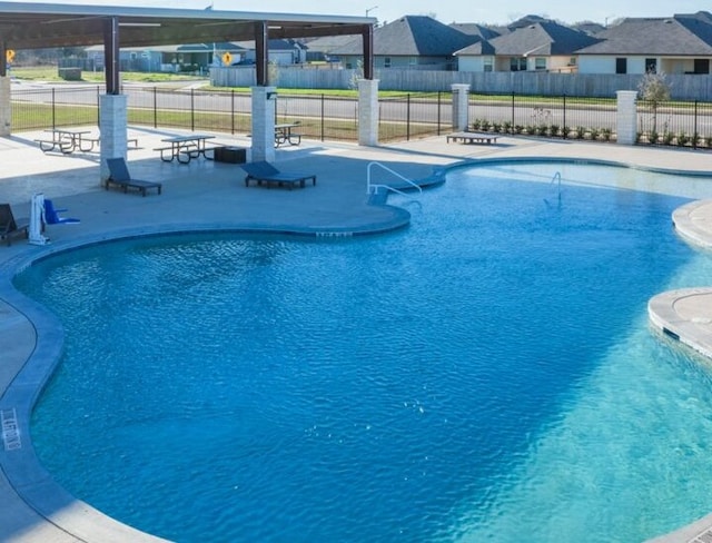 view of pool featuring a patio