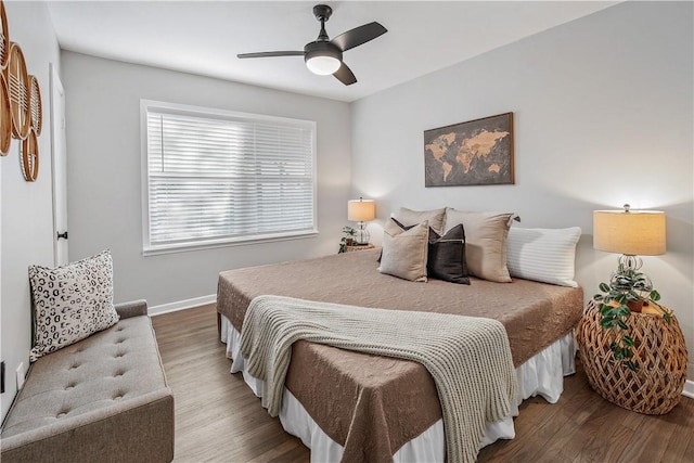 bedroom with hardwood / wood-style flooring and ceiling fan