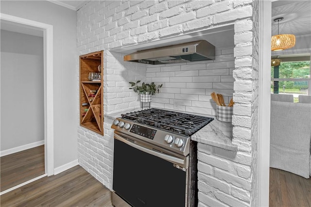 kitchen featuring dark hardwood / wood-style floors, light stone counters, extractor fan, and gas range