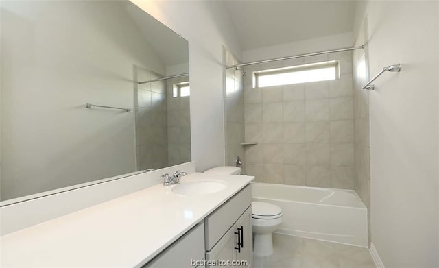 full bathroom with lofted ceiling, vanity, tiled shower / bath combo, and toilet