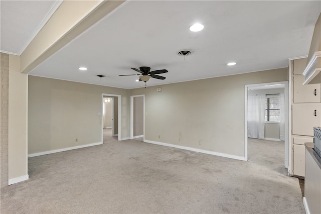 spare room with recessed lighting, visible vents, light carpet, and baseboards