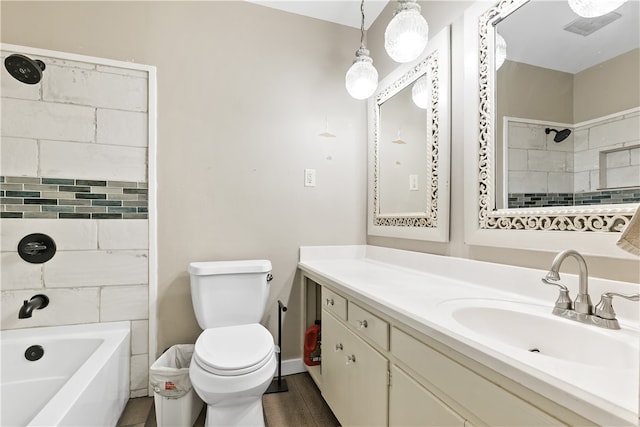 bathroom featuring wood finished floors, tub / shower combination, vanity, and toilet