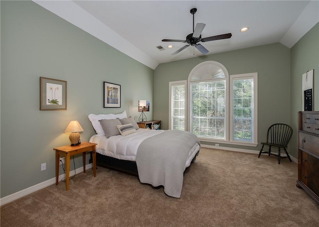 bedroom with carpet flooring, ceiling fan, and vaulted ceiling