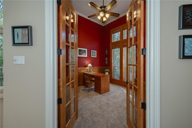 office space featuring ceiling fan, light carpet, and french doors