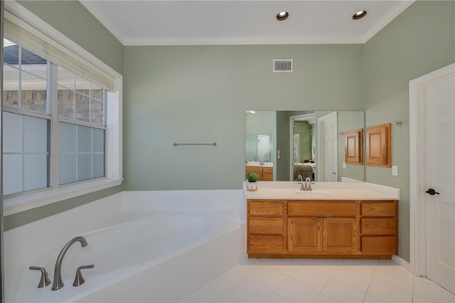 bathroom featuring vanity, a bathtub, and crown molding