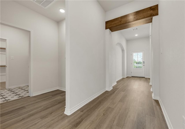 corridor featuring light hardwood / wood-style flooring