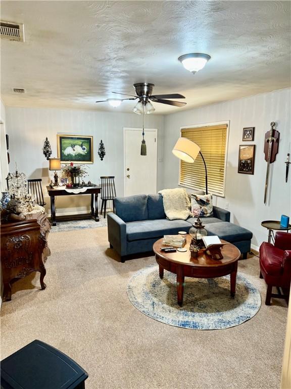 312 S 5th St, Crockett, TX 75835 - carpeted living area featuring a ceiling fan