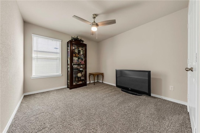 interior space with ceiling fan and carpet floors