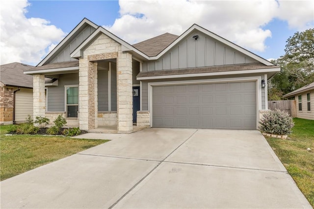 view of front facade with a garage and a front yard