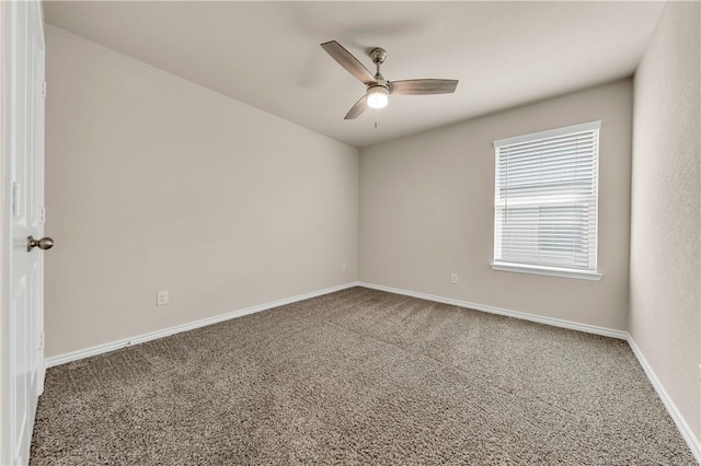 unfurnished room featuring ceiling fan and carpet floors