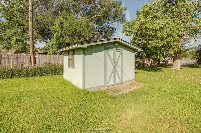 view of outdoor structure with a lawn