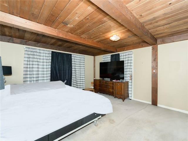 carpeted bedroom featuring beam ceiling and wooden ceiling