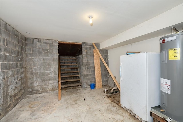 basement with white fridge and water heater