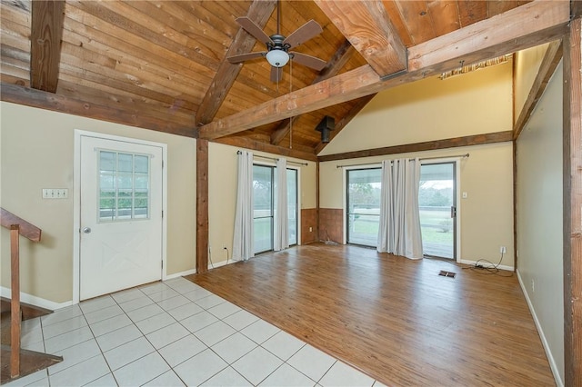 interior space featuring ceiling fan, light tile patterned flooring, wooden ceiling, and a wealth of natural light