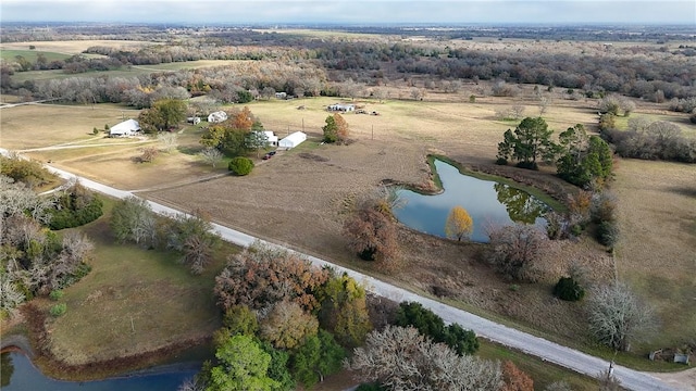 drone / aerial view with a water view and a rural view