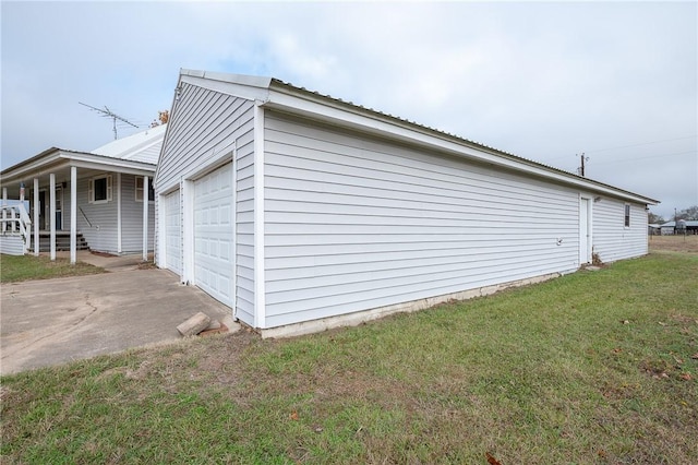 view of home's exterior with a lawn and covered porch