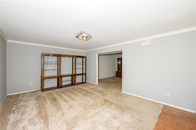 carpeted spare room with ornamental molding