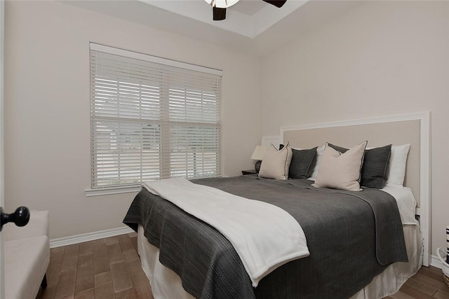 bedroom featuring ceiling fan and dark hardwood / wood-style flooring