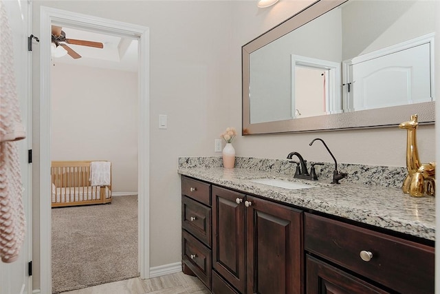 bathroom with vanity and ceiling fan