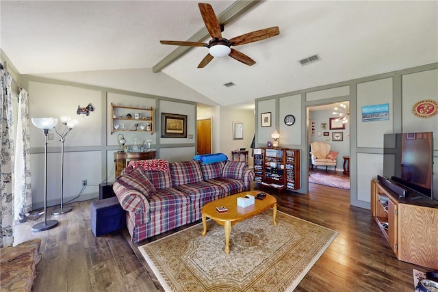 living area featuring visible vents, lofted ceiling with beams, wood finished floors, a decorative wall, and ceiling fan