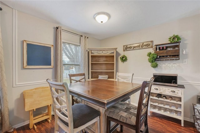 dining area featuring dark hardwood / wood-style flooring