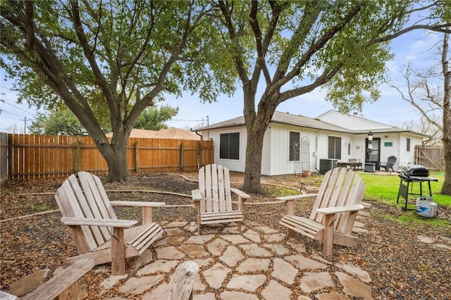 back of property featuring central AC and a patio