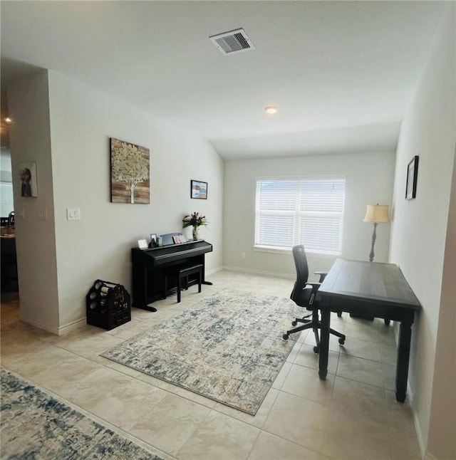 tiled office with vaulted ceiling