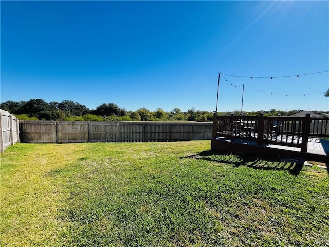 view of yard with a deck