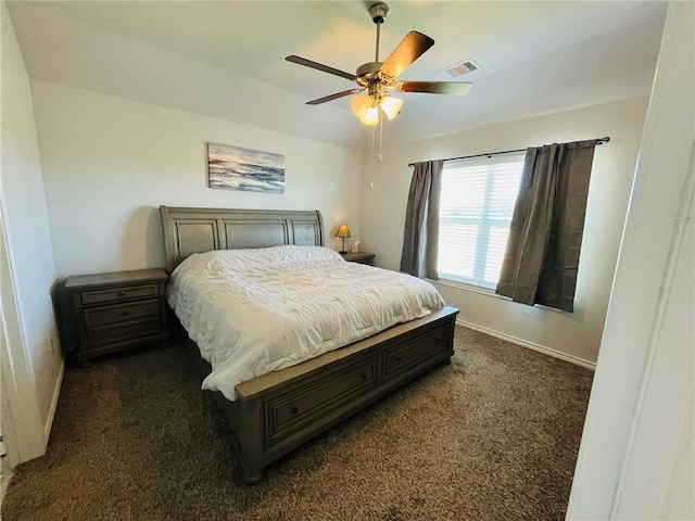 bedroom featuring ceiling fan and dark carpet