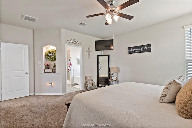 bedroom featuring ceiling fan, carpet floors, and ensuite bathroom