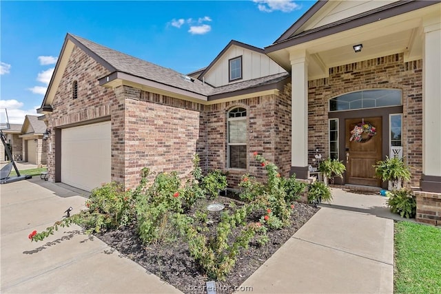 view of exterior entry with a garage